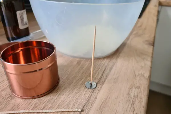 A photo of the wick I made for a candle with a toothpick