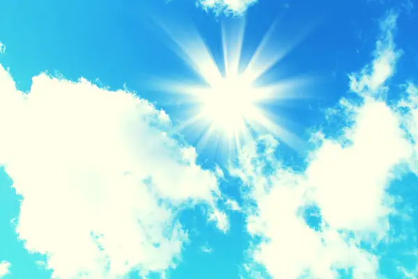 A photo of the sun against a beautiful blue sky