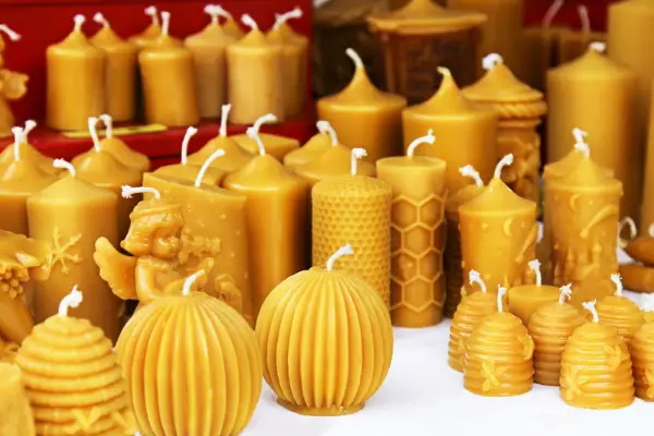 A photo of several different shape and style pure beeswax candles
