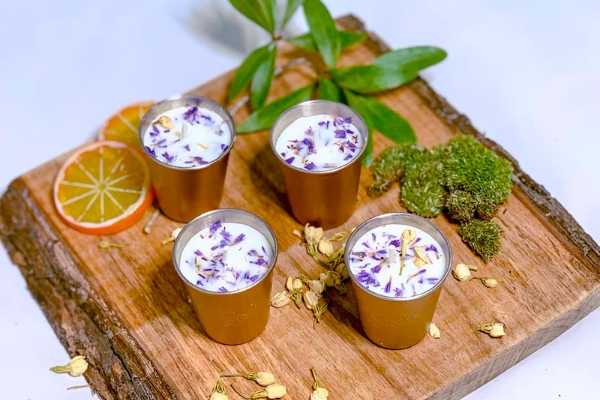 A photo of my soy wax candles with dried lavender flowers in them