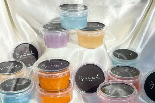 a photo of several gel wax melts in clear pots