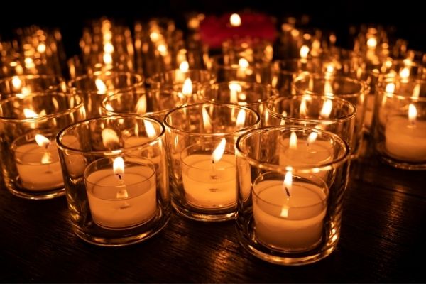 A photo of 20 candles being used to light a room