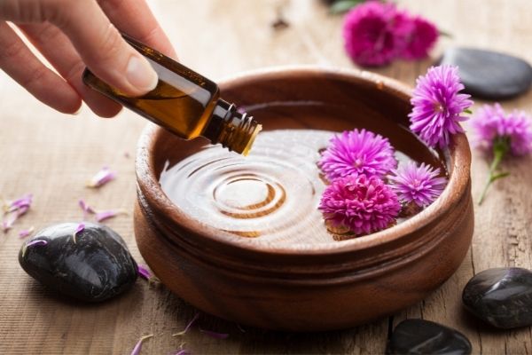 A photo of essential oils being diffused for better sleep