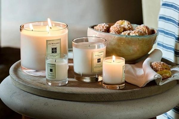 A photo of a range of Jo Malone candles in various scents and sizes