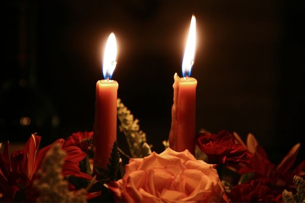 A photo of two really bright lit candles being stared at